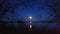 A moon at blue night, reflection on The water