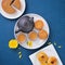 Moon cake for Mid-Autumn Festival, delicious beautiful fresh mooncake on a plate over blue background table