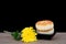 Moon cakes and a yellow chrysanthemum for the Mid-Autumn Festival on the table.Chinese characters on the moon cake means `Five kin