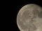 The Moon close-up on a black night sky shot through a telephoto camera