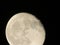 The Moon close-up on a black night sky shot through a telephoto camera
