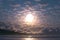 Moon and clouds create captivating atmosphere above serene ocean