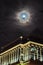 Moon and clouds observing over city