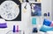 Moon and cosmos graphics on the wall of stylish white living room with colorful accessories, real photo
