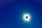 The moon covers the sun in a beautiful solar eclipse, bright stars in the sky