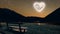 a moon heart-shaped shines over sea on valentine\'s day