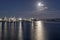 Moon light on north side of Lambton bay with dock of industrial harbor, Wellington, New Zealand