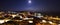 Moon and night view on the city  `Castiglione della Pescaia`.