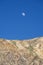 Moon over desert mountains