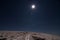 Moon over snowy path