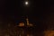 The moon over St Cuthbert and Edinburgh castle