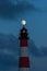 Moon over the Westerhversand lighthouse at the blue hour
