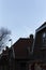 Moon Peeking Above Residential Area