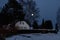 Moon peeping over the forest of an old farmhouse estate in a secluded place