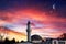 A moon in the pink clouds of the night. Mosque against the background of the sky