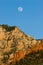 Moon rises over mesas and buttes near Sedona, Arizona