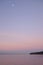 Moon rises through pastel skies over Semiahmoo Bay, White Rock