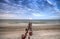 Moon set over an old pier in the ocean at Port Royal Beach