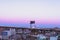 The Moon sets behind the elevated portion of the Brooklyn Queens Expressway