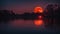 moon setting reflecting over the lake red moon over water representing passion emotion water The moon is fiery and reddish orange