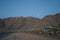 The moon shines over the mountains in Dahab, South Sinai Governorate, Egypt