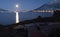 Moon shining on wrecked boat at arctic coastline