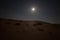 Moon and stars in the dunes in the desert of Rub al Khali or Empty Quarter