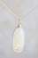 Moon stone sterling silver simple pendant on neutral background