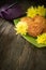 Mooncakes, teapot, yellow chrysanthemum flowers on wooden background. Chinese mid-autumn festival food