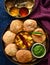 Moong dal kachori and potato curry with mint chutney