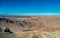 Moonlike landscape of dunes, rugged mountains and geological rock formations of Valle de la Luna Moon valley in Atacama desert,