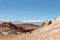 Moonlike landscape of dunes, rugged mountains and geological rock formations of Valle de la Luna Moon valley in Atacama desert,