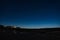 A moonlit view of the night sky over the beach at Beadnell , Northumberland in the United Kingdom