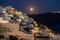 Moonrise at evening at Oia Santorini Greece