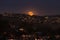 Moonrise of a full moon over the coastline of Laguna Beach