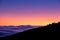 Moonrise over inversion clouds