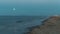 Moonrise timelapse. full moon rising on the sea. Night beach. 4K