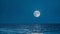 The moons radiance unfurled upon the calmness of the ocean creating a sense of serenity and harmony in the night. .