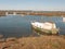 Moored boat in estuary river stream tollesbury essex marsh land