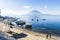 Moored boats, beach & volcanoes, Lake Atitlan, Guatemala