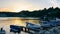 moored boats at the sea pier against the sunset sky