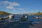 Moored boats at wood jetty`s, Lakeland fells backdrop. From Bowness-on Windermere, Cumbria