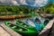 Moored canoes and wooden boats on the lake Bohinj, Slovenia