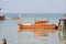 Moored colorful orange fishing boat