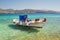 Moored fishing boat in the clear sea water