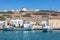 Moored fishing boats at dock background. Koufonisi island, Cyclades, Greece