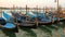 Moored gondolas on the background of the canale della Giudecca in the early morning. Venice