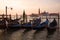 Moored gondolas in the background of the Cathedral of San Giorgio Maggiore, Venice