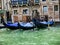 Moored gondolas on a side canal in Venice Italy