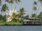 Moored houseboat near catholic church, Kerala, India